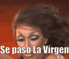 a close up of a woman 's face with the words se paso la virgen on it