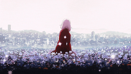 a girl in a red coat is standing in a field of flowers with a city in the background