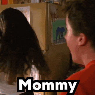 a man in a red shirt is standing next to a woman with the word mommy on the bottom right