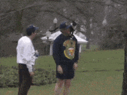 a man with a cat on his shoulder wears a sweatshirt that says vince