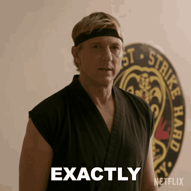 a man in a karate uniform says exactly in front of a netflix logo
