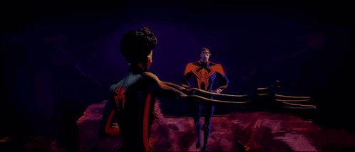 a man and a woman are standing next to each other and the man has a spider on his chest