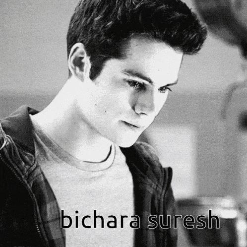 a black and white photo of a young man with the name bichara suresh