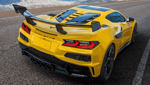 a yellow corvette with a license plate that says ypf 880