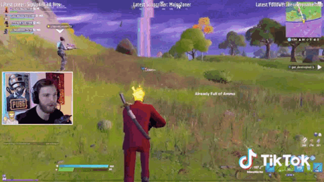 a man is playing a video game called pubg and has a tik tok sticker on his screen