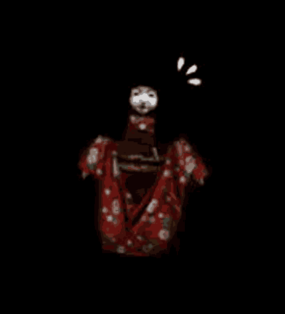 a scary doll in a red kimono is standing on a black background .