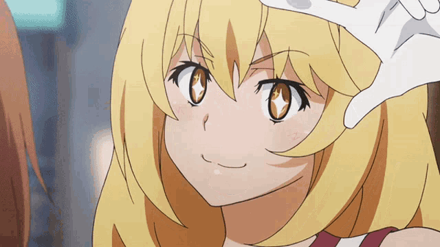 a girl with blonde hair and brown eyes is making a peace sign