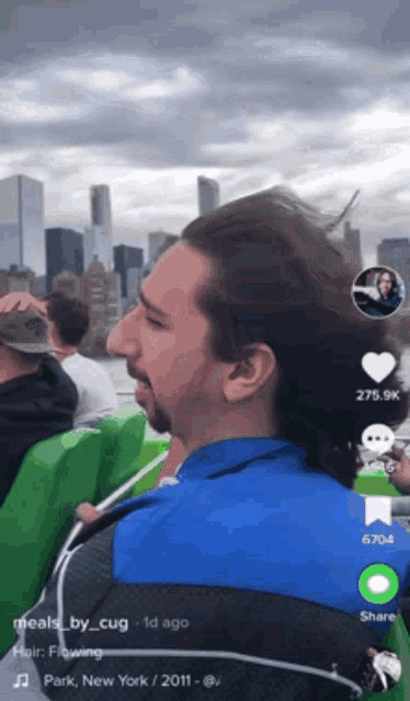 a man with a ponytail is on a boat in park new york 2011