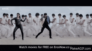 a man and a woman are dancing in front of a group of people ..