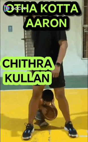 a man is dribbling a basketball on a basketball court with the name chithra kullan on the bottom right