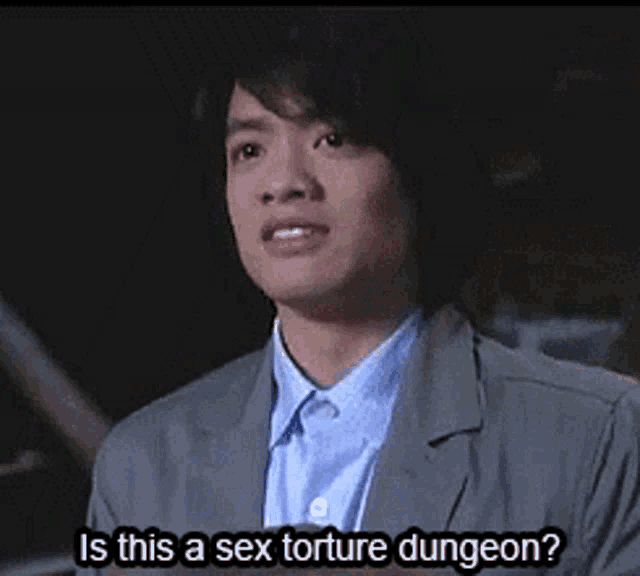a man in a suit is asking if this is a sex torture dungeon .
