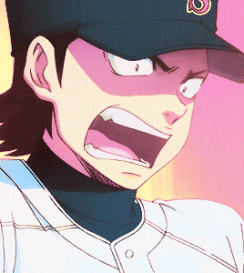 a close up of a person wearing a hat with the letter b on it