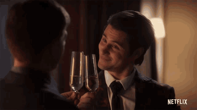 a man in a suit and tie is toasting another man with champagne glasses with a netflix logo in the background