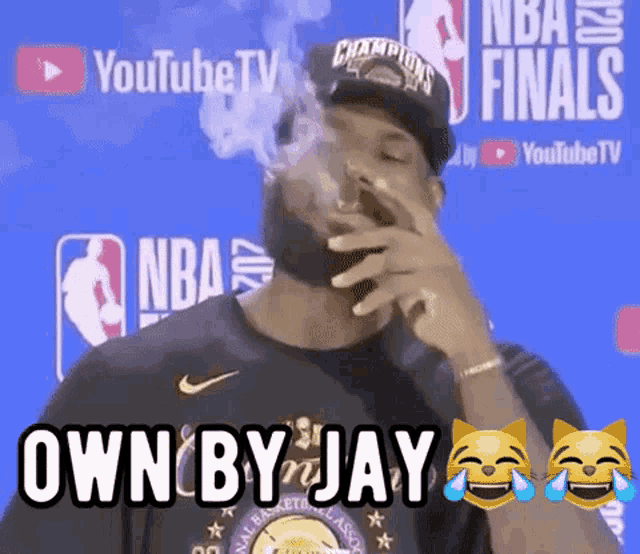 a man smoking a cigarette with the words " own by jay " written above him