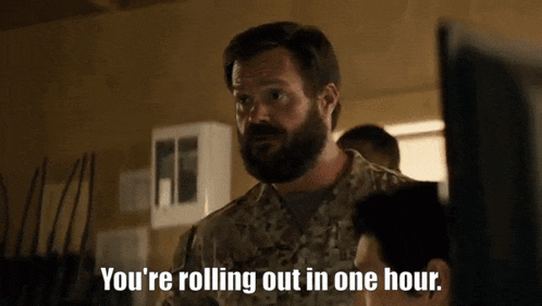 a man in a military uniform is talking about rolling out in one hour