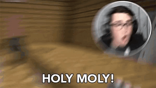 a blurry picture of a man with glasses and the words holy moly .