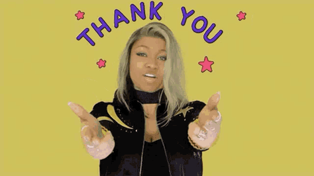 a woman is giving a thank you gesture with her hands in front of a yellow background .