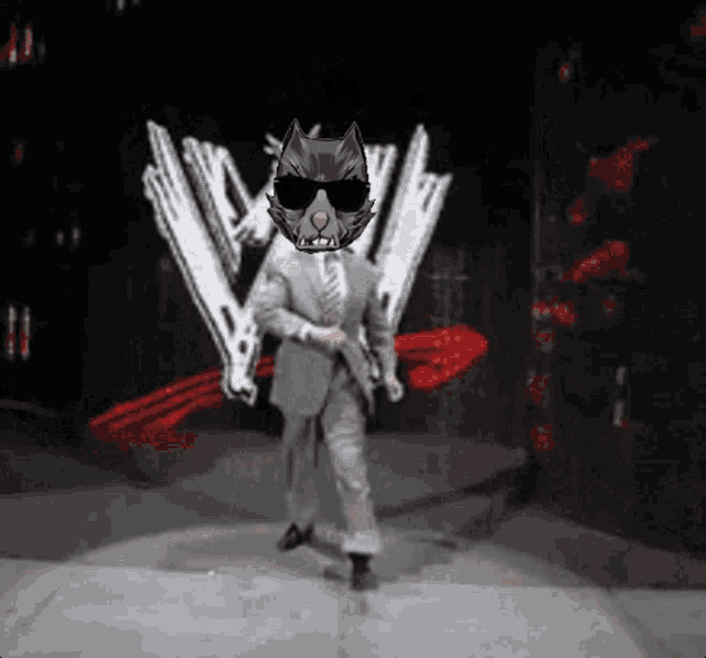 a man in a suit and tie with a rat mask on his head