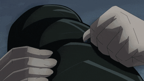 a close up of a person 's fist with a black background