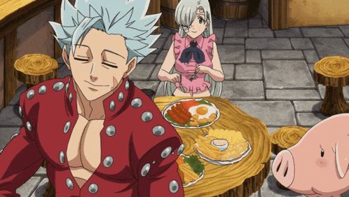 a man in a red jacket sits at a table with a plate of food