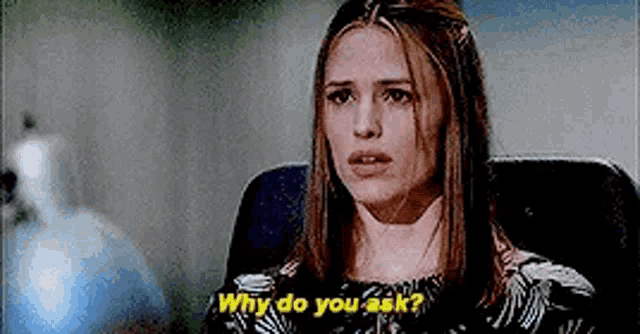a woman is sitting in a chair asking why do you ask ?