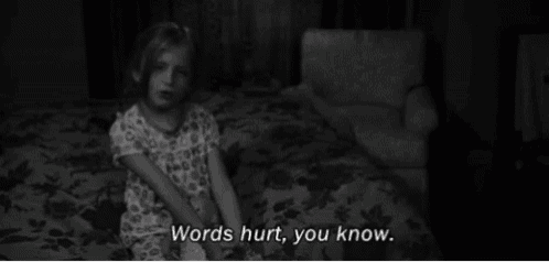 a little girl is sitting on a couch with the words words hurt you know written below her