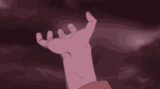 a person is standing in the water with a light coming out of his hand .