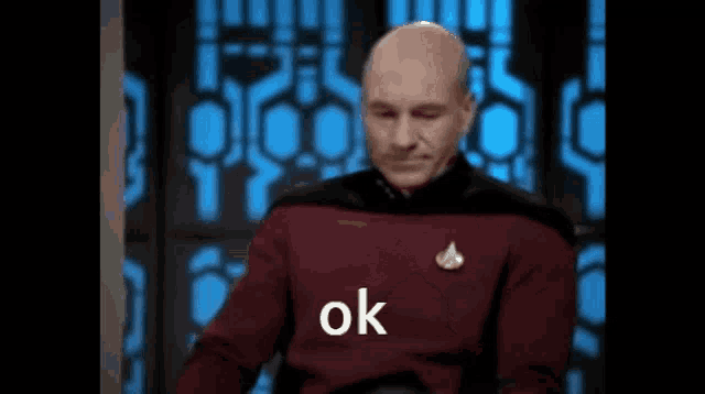a man in a star trek uniform is giving the ok sign