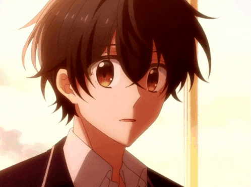 a close up of a boy 's face with a shadow on his face