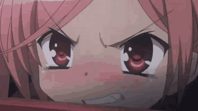 a close up of a pink haired anime girl with red eyes making a funny face .