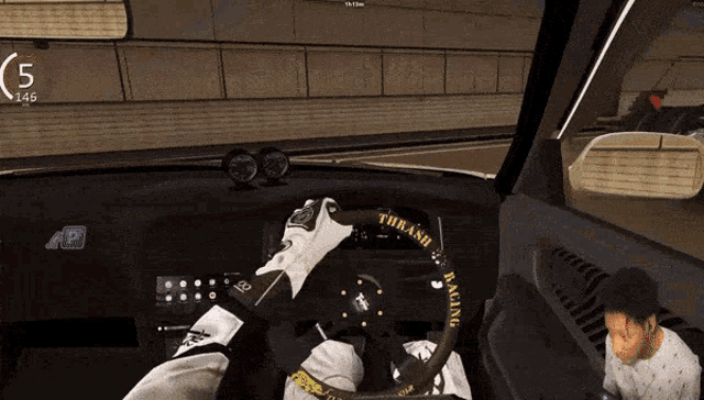 a video game shows a person driving a car with a steering wheel that says thrash racing