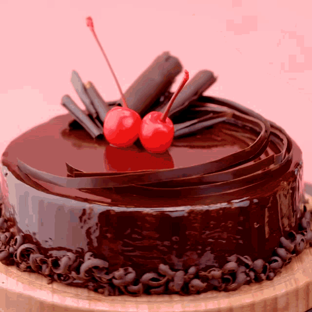 a chocolate cake with a cherry on top