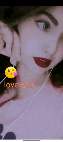 a girl wearing headphones and a pink shirt with the words love you on the bottom right