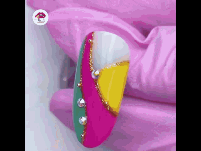 a close up of a woman 's nail with a colorful design on it