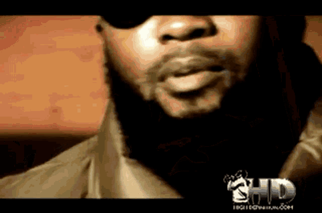a close up of a man 's face with the word hd on the bottom left