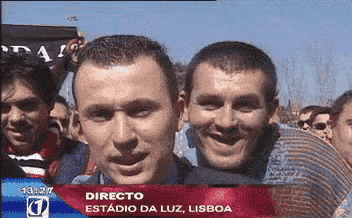 a group of men are standing in front of a sign that says directo estadio da luz lisboa