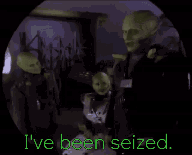 a group of green aliens standing next to each other with the words " i 've been seized " written in green