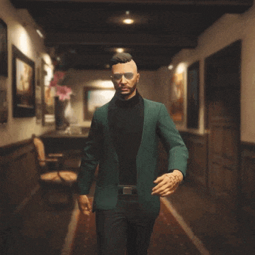 a man in a green jacket and black sweater is walking down a hallway