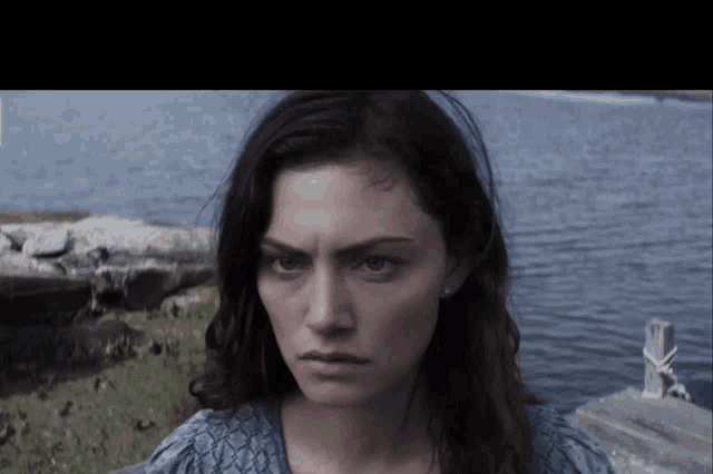 a woman with a serious look on her face