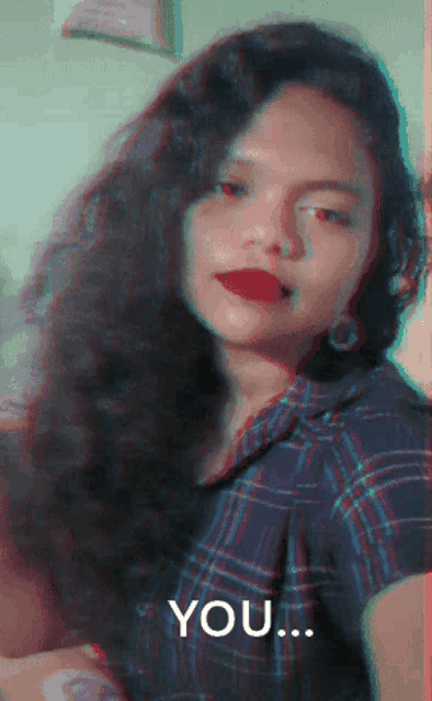 a woman taking a selfie with the words " you " in the corner