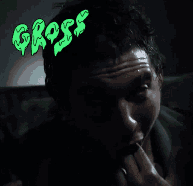a close up of a man 's face with the word gross written above him