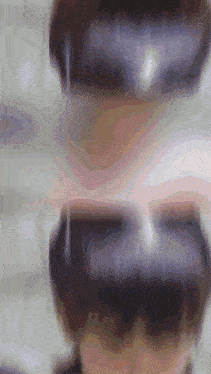 a close up of a person wearing sunglasses with a blurry background