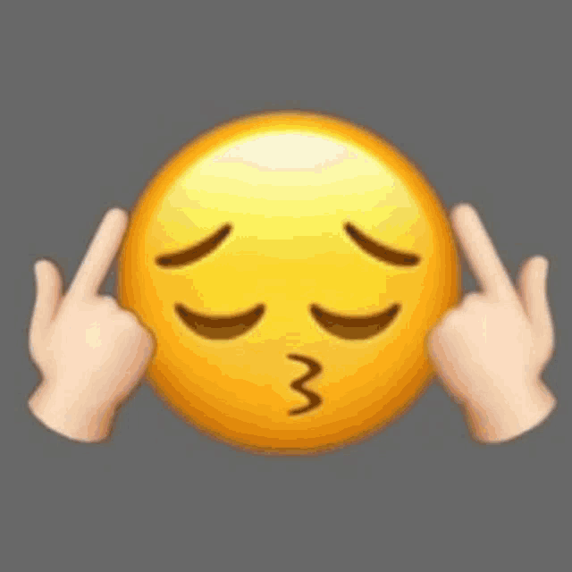 a blurry picture of a person holding a smiley face with their hands