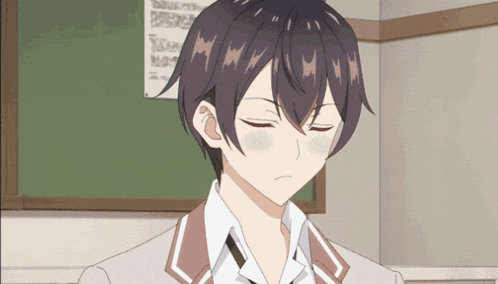 a boy with his eyes closed in front of a chalkboard