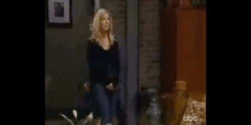 a man and a woman are standing next to each other and looking at each other .