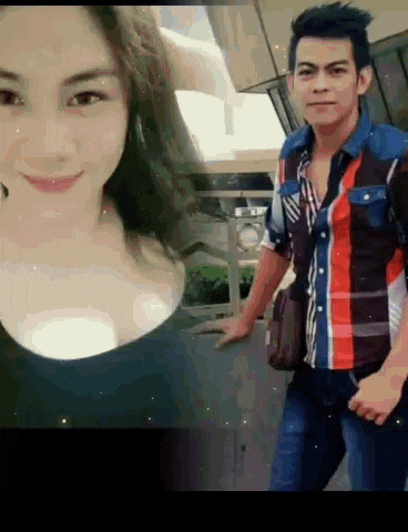 a man and woman are posing for a picture together