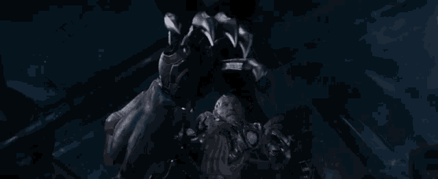 a close up of a person being attacked by a giant octopus .