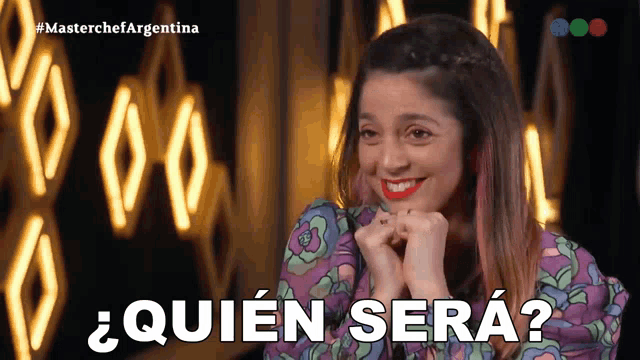 a woman in a purple dress is smiling and says " quien sera "