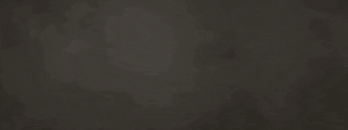 two men 's fists are bumped against each other on a black background