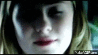 a close up of a girl 's face with a black eye